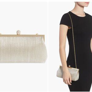 Pleated clutch with delicate drop-in chain strap.